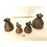 SET OF FOUR SMALL GRADUATING COPPER JUGS.