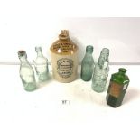A STONEWARE GINGER JAR BY BIDDLE & GINGELL LTD, LEYTON. AND GREEN GLASS CHEMISTS BOTTLE AND FOUR