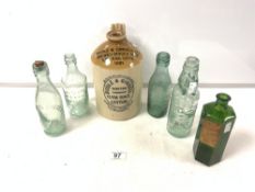 A STONEWARE GINGER JAR BY BIDDLE & GINGELL LTD, LEYTON. AND GREEN GLASS CHEMISTS BOTTLE AND FOUR