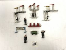 A LESNEY TOY PETROL PUMP STAND, CRESCENT RAILWAY SIGNAL STANDS AND FIGURES.