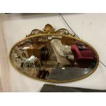 LARGE OVAL BEVELLED EDGED WALL MIRROR GILDED EDGED AND DECORATED IN ROCOCO STYLE 113 X 74 CM
