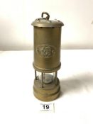 A BRASS " CYMRU " MINERS LAMP BY NED PRODUCTS LTD, 22CMS.