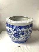 A REPRODUCTION CHINESE BLUE AND WHITE CERAMIC FISH BOWL. 30 X 36.