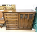 GOTHIC STYLE CUPBOARD IN OAK WITH SIX DRAWERS AND ORNATE CARVING TO FRONT OF DOOR 148 X 52 X 109 CM