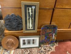 TWO CARVED TRIBAL PLAQUES, TWO FRAMED TRIBAL DISPLAYS, AND A DRINKS TRAY.