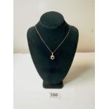 A 9ct GOLD PENDANT SET WITH DIAMOND, RUBY, EMERALD, AND SAPPHIRE ON CHAIN, 5.2 GRAMS.