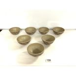 SEVEN MATCHING STUDIO POTTERY BOWLS BY RACHEL SWIFT. BEARING THE SWIFT STAMP TO BASE.