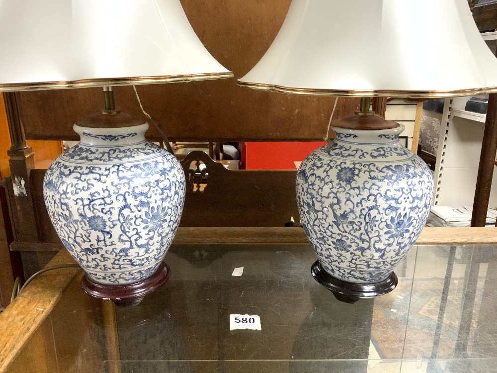 A PAIR OF MODERN CHINESE DESIGN BLUE AND WHITE VASE LAMPS, 26 CMS. - Image 2 of 3