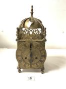 A LARGE BRASS LANTERN CLOCK WITH A GERMAN STRIKING MOVEMENT AND ENGRAVED CHAPTER RING, 36CMS.