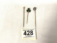 A CIRCULAR STICK PIN SET WITH OLD CUT DIAMOND CHIPS, THREE LEAF CLOVER STICK PIN AND 1 MORE