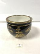 A BLACK AND GOLD LACQUER DECORATED PORCELAIN JARDINERE, 15 X 20.