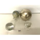 A CRYSTAL BALL ON STAND, CLEAR GLASS PAPERWEIGHT, A COLOURED WOODEN BALL ON THREE HANDLE GLASS BOWL,