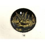 A FRENCH ARCOPAL BLACK AND GOLD DECORATED SOUVENIR PLATE. 30 CMS.