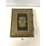 A VICTORIAN LEATHER BOUND FAMILY BIBLE WITH ORNATE BRASS CLASPS.