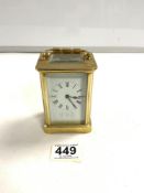 A BRASS CARRIAGE TIME PIECE WITH WHITE ENAMEL DIAL