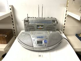 A JVC BIPHONIC PORTABLE CASSETTE / RADIO PLAYER, AND A PANASONIC RX-ES25 POWER BLASTER CD / RADIO