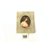 OVAL GILT FRAMED MINATURE ON PORCELAIN PORTRAIT OF A YOUNG WOMAN; SIGNED WAGNER, 8 X 6.5