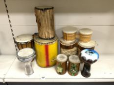 A QUANTITY OF TRIBAL AND OTHER DRUMS.