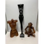 TWO CARVED WOODEN FIGURES WITH A LARGE WOODEN CARVED TORSO LARGEST 83 CM