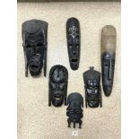 SIX AFRICAN CARVED WOODEN WALL MASKS.