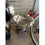 A RECONSTITUTED STONE SCALLOP SHAPED BIRD BATH.52X44