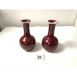A PAIR OF CHINESE RED SANG de BEOUF GLAZED VASES, 16CMS.
