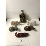 TWO SOAPSTONE HIPPOS AND A RHINOCEROS, A MARBLE PIG, AND AN INDIAN CARVED WOODEN WALL MOUNT.