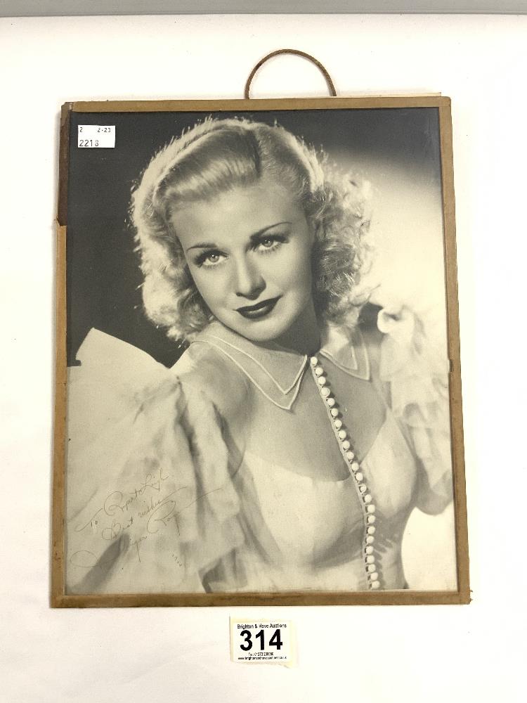 A SIGNED PORTRAIT PHOTOGRAPH OF GINGER ROGERS.