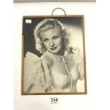 A SIGNED PORTRAIT PHOTOGRAPH OF GINGER ROGERS.