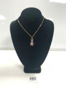 750 GOLD NECKLACE WITH A 375 GOLD AND AMETHYST RABBIT