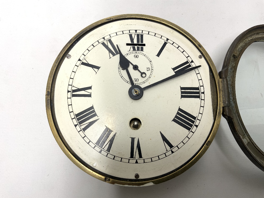 A BRASS SHIPS CLOCK, WITH PAINTED DIAL, AND SUBSIDERY DIAL, 17CMS DIAMETER. - Image 2 of 4