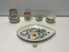 A POOLE POTTERY VASE, 13 CMS, AND FOUR OTHER PIECES OF POOLE POTTERY.
