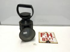 A VINTAGE METAL RAILWAY LAMP, AND A SMALL ENAMEL SIGN F.H SAYING '85ft'
