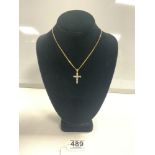 750 GOLD NECKLACE WITH A 375 GOLD CRUCIFIX WITH STONES