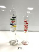 TWO GLASS GALILEO THERMOMETERS, 34 CMS TALLEST.