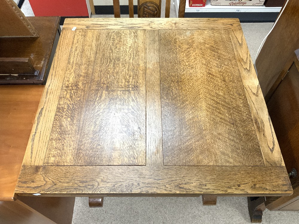 A 1940s OAK DINING SUITE WITH CARVED HEAD MOTIFS DECORATION - INCLUDES A DRAW LEAF TABLE, FOUR - Image 5 of 12