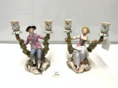 PAIR OF NINETEENTH-CENTURY MEISSEN PORCELAIN TWO-BRANCH FIGURAL CANDLESTICKS, ON ROCOCO BASES AND