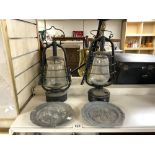 TWO VINTAGE METAL OIL LANTERNS, AND A PAIR OF EMBOSSED PEWTER PLATES.
