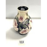 A MOORCROFT PALE PINK ROSE PATTERN VASE WITH CREAM AND BLUE BACK GROUND, 19CMS.