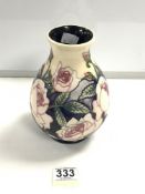 A MOORCROFT PALE PINK ROSE PATTERN VASE WITH CREAM AND BLUE BACK GROUND, 19CMS.