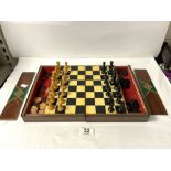 A FOLDING CHESS BOARD AND PIECES