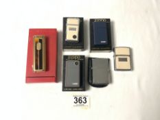 FOUR ZIPPO LIGHTERS, A CHAMP LIGHTER, AND MISTRAL ELECTRONIC LIGHTER.