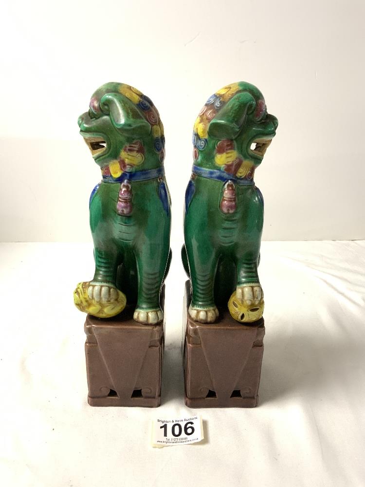 A PAIR OF CHINESE DOGS OF FOO, IN GREEN, YELLOW AND BROWN GLAZE, 26 CMS. - Image 3 of 4