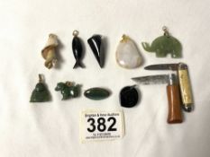 TWO JADE ANIMAL PENDANTS, BUTTERFLY WING BROOCH, PENDANTS, TWO POCKET KNIVES AND MORE.