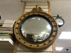 VINTAGE GILDED CONVEX WALL MIRROR WITH A MOUNTED EAGLE 61CM