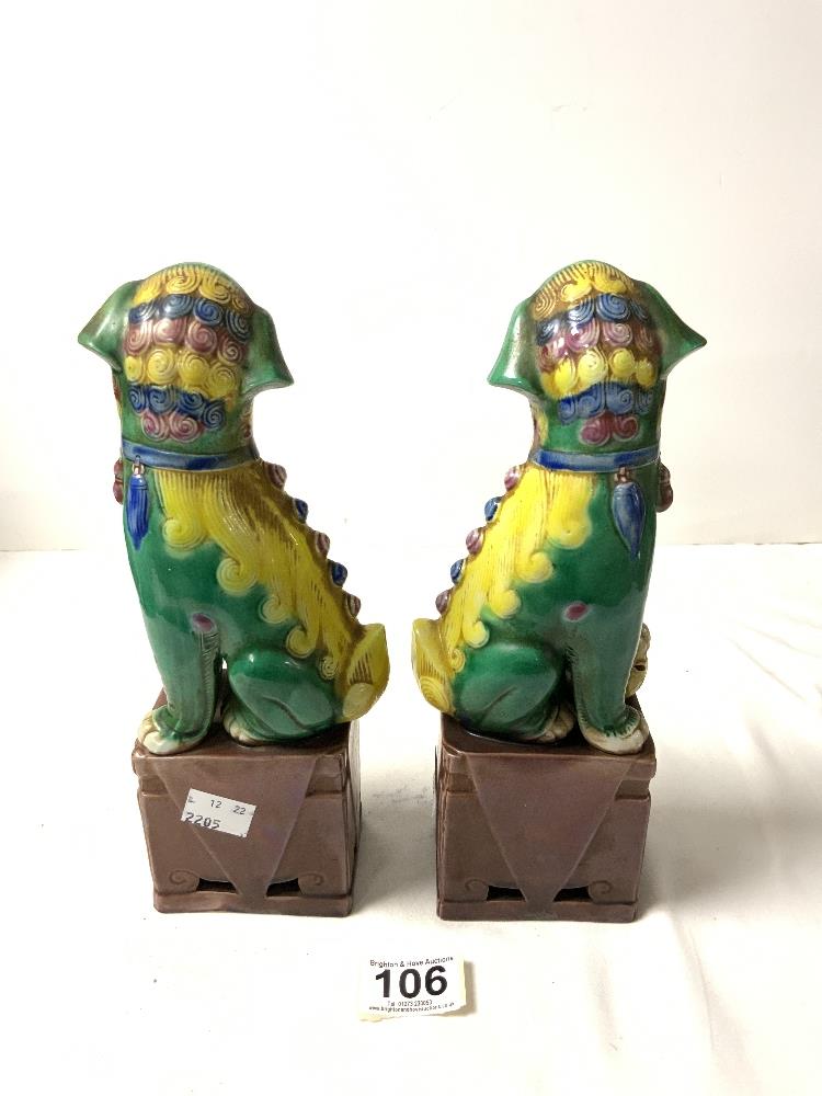 A PAIR OF CHINESE DOGS OF FOO, IN GREEN, YELLOW AND BROWN GLAZE, 26 CMS. - Image 2 of 4