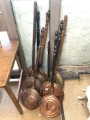 EIGHT VICTORIAN COPPER AND BRASS BED PANS