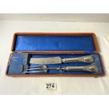 A NINETEENTH CENTURY FRENCH SILVER HANDLED CARVING KNIFE AND FORK IN FITTED LEATHER CASE.