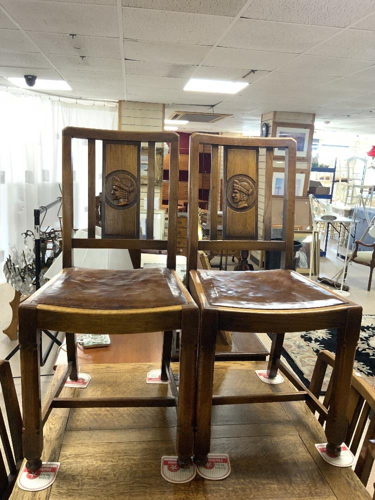 A 1940s OAK DINING SUITE WITH CARVED HEAD MOTIFS DECORATION - INCLUDES A DRAW LEAF TABLE, FOUR - Image 10 of 12