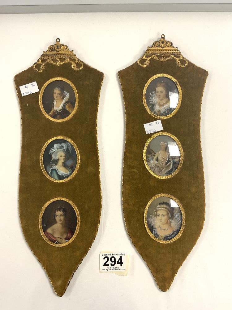A PAIR OF TRIPLE OVAL HAND PAINTED PORTRAIT MINATURES OF LADIES, FRAMED IN GILT METAL ON VELVET.